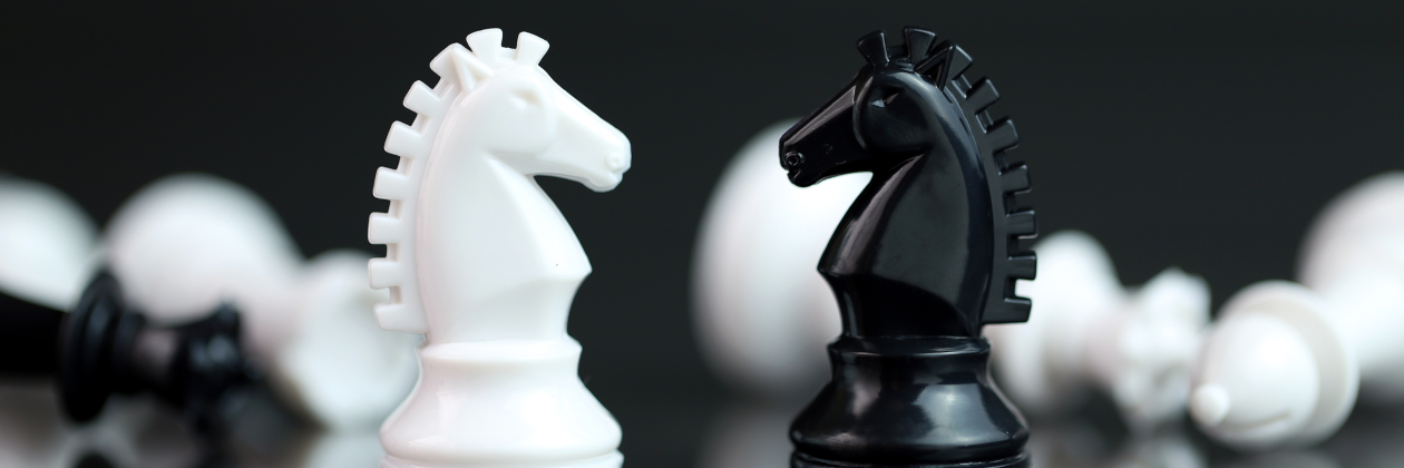 chess pieces facing each other. 